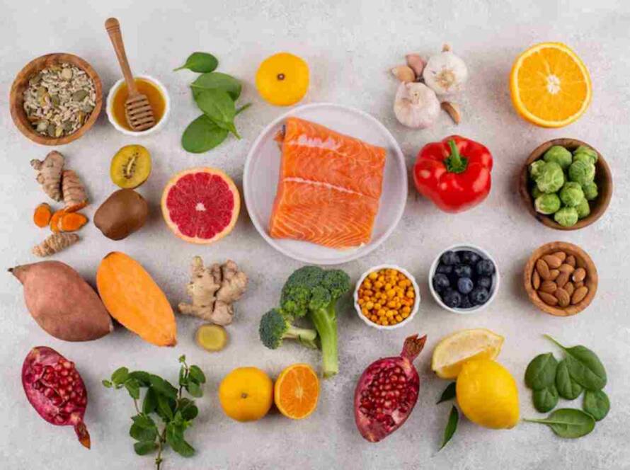 Colorful healthy foods on light gray background