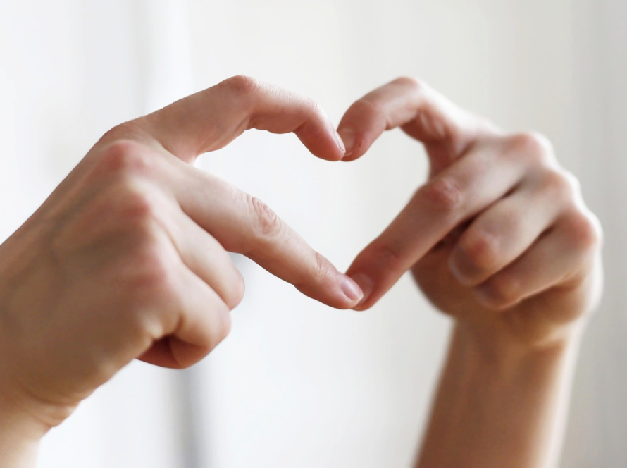 Two hands forming a heart shape gesture